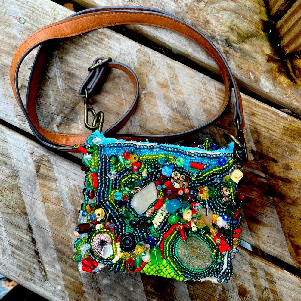 Hand-crafted, one of a kind, beaded bag. Made using beach glass,stones, shells